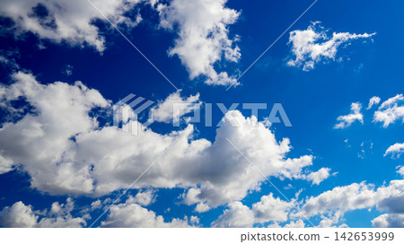 large fluffy cumulus cloud centered in a vivid blue sky surrounded by soft light clouds large fluffy cumulus cloud centered in a vivid blue sky surrounded by soft light clouds 142653999