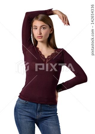 Slavic woman in burgundy lace top and jeans Slavic woman in burgundy lace top and jeans 142654336