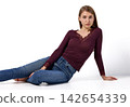 Slavic woman in lace top posing on floor 142654339