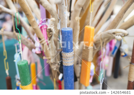 Greek Easter candles, assortment selection of handmade crafted traditional lambada, multicoloured wax candles with ribbon for sale in local store market, Orthodox Easter traditions in Athens, Greece Greek Easter candles, assortment selection of handmade crafted traditional lambada, multicoloured wax candles with ribbon for sale in local store market, Orthodox Easter traditions in Athens, Greece 142654681