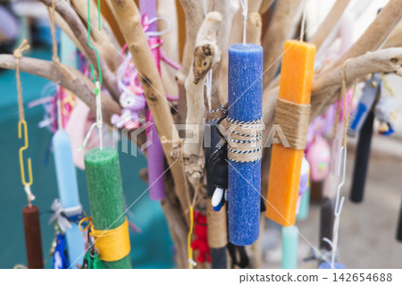 Greek Easter candles, assortment selection of handmade crafted traditional lambada, multicoloured wax candles with ribbon for sale in local store market, Orthodox Easter traditions in Athens, Greece Greek Easter candles, assortment selection of handmade crafted traditional lambada, multicoloured wax candles with ribbon for sale in local store market, Orthodox Easter traditions in Athens, Greece 142654688