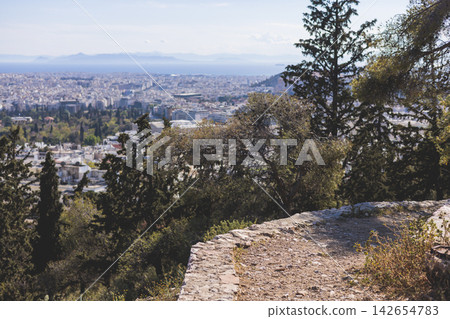 Mount Lycabettus, Athens, Greece, hiking and climbing to Lycabettos hill and Holy Church of Saint George of Lycabettus, Attica, Athens cityscape panorama view in sunny day, Lykavittos Greek landscape Mount Lycabettus, Athens, Greece, hiking and climbing to Lycabettos hill and Holy Church of Saint George of Lycabettus, Attica, Athens cityscape panorama view in sunny day, Lykavittos Greek landscape 142654783