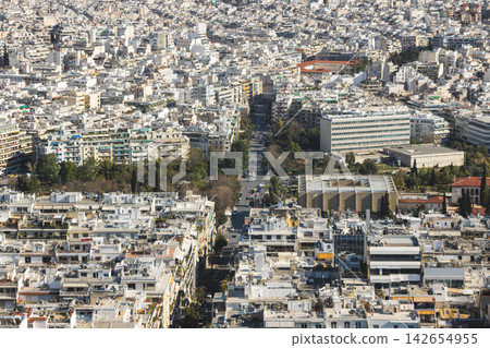 Athens, Attica, Greece, beautiful panoramic view of Athens cityscape, with The Parthenon, mountains, sea and scenery beyond the city, seen from Mount Lycabettus Hill observation deck in a sunny day Athens, Attica, Greece, beautiful panoramic view of Athens cityscape, with The Parthenon, mountains, sea and scenery beyond the city, seen from Mount Lycabettus Hill observation deck in a sunny day 142654955