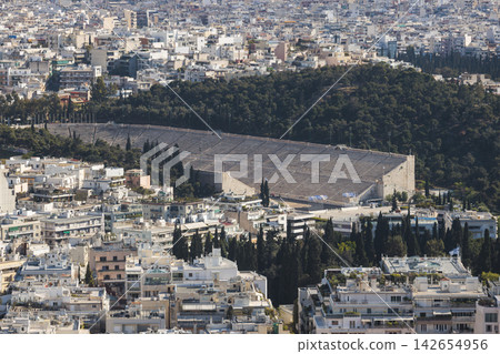 Athens, Attica, Greece, beautiful panoramic view of Athens cityscape, with The Parthenon, mountains, sea and scenery beyond the city, seen from Mount Lycabettus Hill observation deck in a sunny day Athens, Attica, Greece, beautiful panoramic view of Athens cityscape, with The Parthenon, mountains, sea and scenery beyond the city, seen from Mount Lycabettus Hill observation deck in a sunny day 142654956