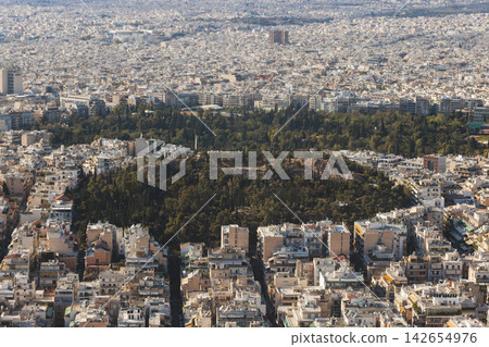 Athens, Attica, Greece, beautiful panoramic view of Athens cityscape, with The Parthenon, mountains, sea and scenery beyond the city, seen from Mount Lycabettus Hill observation deck in a sunny day Athens, Attica, Greece, beautiful panoramic view of Athens cityscape, with The Parthenon, mountains, sea and scenery beyond the city, seen from Mount Lycabettus Hill observation deck in a sunny day 142654976