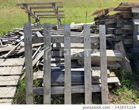 a large pile of wooden construction waste on a suburban site a large pile of wooden construction waste on a suburban site 142655224