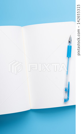 Open Notebook Pen Blue Background Vertical Open Notebook Pen Blue Background Vertical 142655315