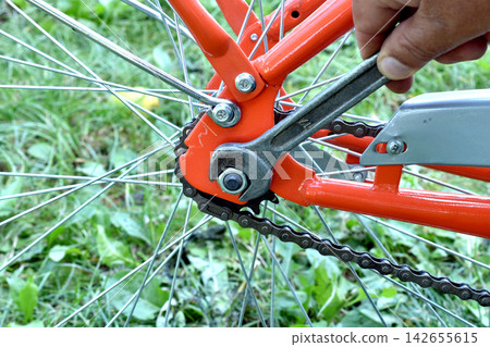 Bicycle repair with an open-end wrench. Bicycle repair with an open-end wrench. 142655615