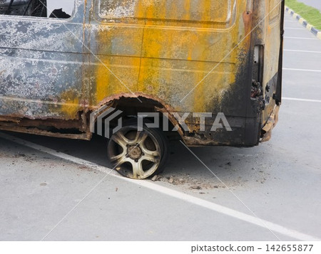 Abandoned Wreck of a Burnt Commercial Vehicle on City Street Abandoned Wreck of a Burnt Commercial Vehicle on City Street 142655877