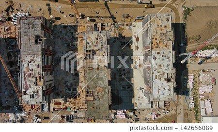 Industrial construction site with houses equipment and materials 142656089