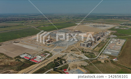 Industrial construction site with construction equipment and materials Industrial construction site with construction equipment and materials 142656101