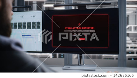 Cybersecurity Specialist Responding to Cyber Attack Alert in Data Center Cybersecurity Specialist Responding to Cyber Attack Alert in Data Center 142656166