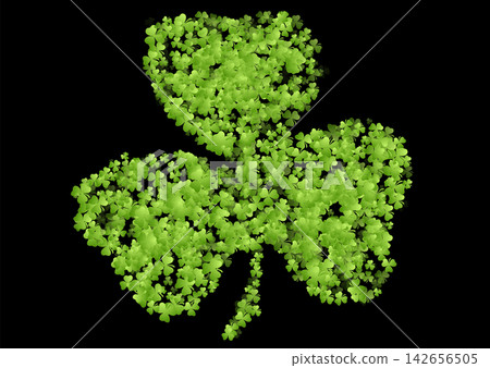 Green shamrock made of small clovers on black background, St Patrick Day symbol of luck Green shamrock made of small clovers on black background, St Patrick Day symbol of luck 142656505
