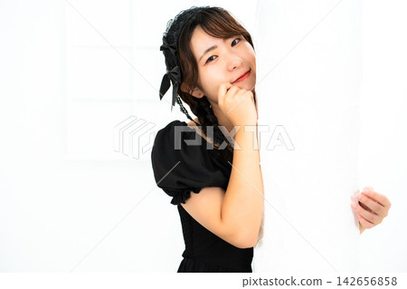 Woman in Gothic Lolita attire Woman in Gothic Lolita attire 142656858