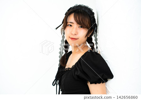 Woman in Gothic Lolita attire Woman in Gothic Lolita attire 142656860