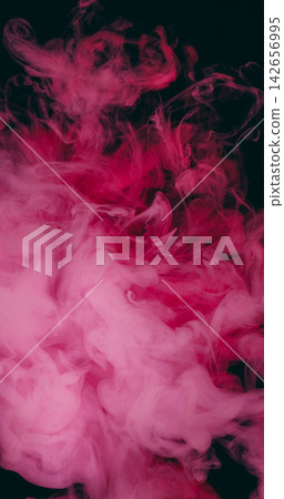 Color smog splash. Pink paint texture. Defocused vibrant art particles chemical underwater fog water pigment spreading on black acrylic abstract background. Color smog splash. Pink paint texture. Defocused vibrant art particles chemical underwater fog water pigment spreading on black acrylic abstract background. 142656995