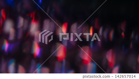 Blur color flare. Light spots. Defocused red blue purple radiant optical neon flash on abstract illuminated creative dark black background. Blur color flare. Light spots. Defocused red blue purple radiant optical neon flash on abstract illuminated creative dark black background. 142657014