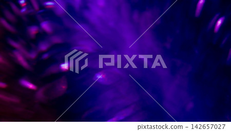 Defocused glitter. Light leak. Blur blue purple pink colorful radiant neon glimmer optical texture on abstract bokeh dark black art background. Defocused glitter. Light leak. Blur blue purple pink colorful radiant neon glimmer optical texture on abstract bokeh dark black art background. 142657027