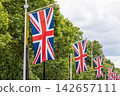 Row of British flags hanging along street in London 142657111