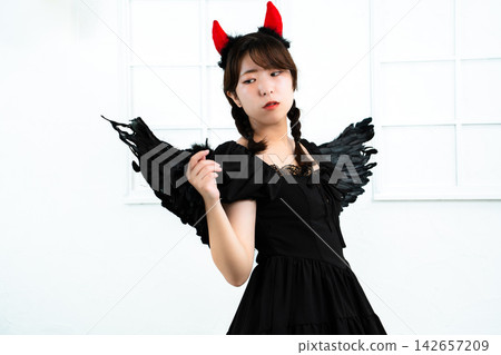 A woman who makes a demon's cosplay A woman who makes a demon's cosplay 142657209