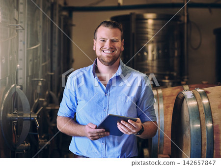Portrait, man and happy with tablet in brewery as manager with pride on product, process and schedule for supplier. Business, barrel and smile for beer production, manufacturing or craft in factory Portrait, man and happy with tablet in brewery as manager with pride on product, process and schedule for supplier. Business, barrel and smile for beer production, manufacturing or craft in factory 142657847