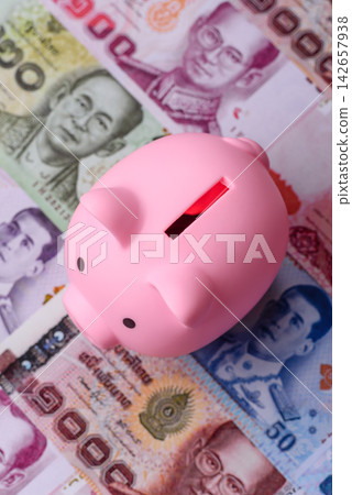 A piggy bank as a concept for storing, accumulating, and saving financial resources A piggy bank as a concept for storing, accumulating, and saving financial resources 142657938