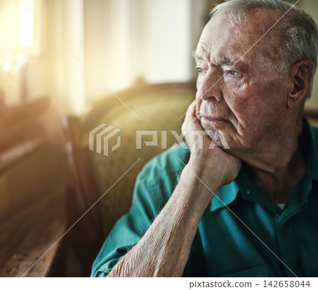Senior, man and thinking with depression for memory in retirement home with remember, nostalgia or reflection on sofa. Elderly, person and sad with alzheimers, grief and thoughtful on couch or mockup 142658044