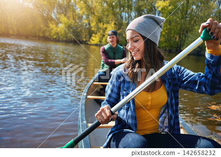 Lake, canoe and couple with love, summer and hobby with vacation, adventure and getaway trip. River, man and woman with activity, honeymoon and travel with relationship, journey and bonding together Lake, canoe and couple with love, summer and hobby with vacation, adventure and getaway trip. River, man and woman with activity, honeymoon and travel with relationship, journey and bonding together 142658232