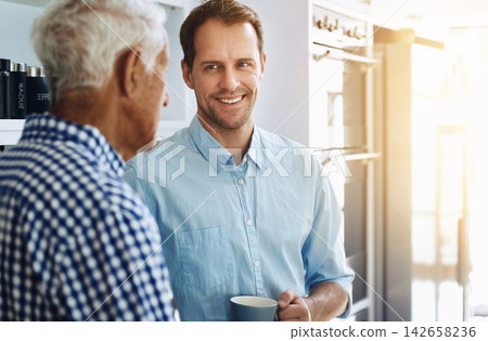 Man, happy and senior father in kitchen with conversation in morning with coffee for bonding in retirement. Proud, dad and son on weekend with together in home for family dinner in the Netherlands. Man, happy and senior father in kitchen with conversation in morning with coffee for bonding in retirement. Proud, dad and son on weekend with together in home for family dinner in the Netherlands. 142658236
