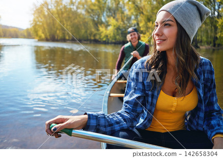 Lake, canoe and couple with nature, happiness and hobby with vacation, bonding together and getaway trip. River, man and woman with activity, honeymoon and travel with adventure, journey and sunshine Lake, canoe and couple with nature, happiness and hobby with vacation, bonding together and getaway trip. River, man and woman with activity, honeymoon and travel with adventure, journey and sunshine 142658304