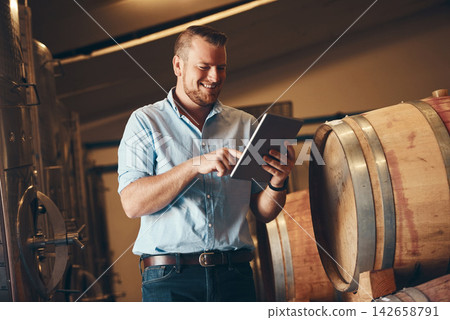 Business, man and proud with tablet in brewery as manager with smile on product, process and schedule for supplier. Employee, barrel and happy for beer production, manufacturing or craft in factory Business, man and proud with tablet in brewery as manager with smile on product, process and schedule for supplier. Employee, barrel and happy for beer production, manufacturing or craft in factory 142658791