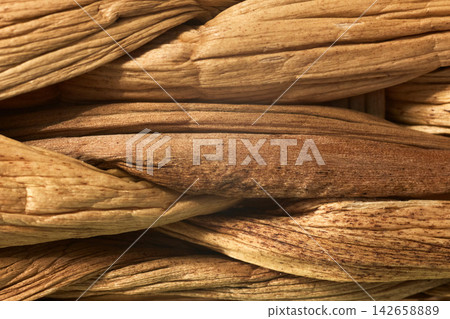 Woven straw texture with warm glowing backlight effect 142658889