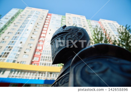 Extreme Close Up Rear View of Engraved Metal Knight Helmet Extreme Close Up Rear View of Engraved Metal Knight Helmet 142658896