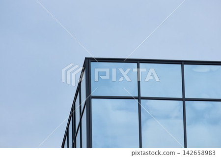 Architectural Glazing Detail of Modern Skyscraper Against Sky Architectural Glazing Detail of Modern Skyscraper Against Sky 142658983
