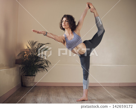 Woman, yoga or dancers pose in house for health, wellness or body flexibility for practice routine. Girl, zen yogi or female person in pilates session for mindfulness, wellbeing or balance on floor Woman, yoga or dancers pose in house for health, wellness or body flexibility for practice routine. Girl, zen yogi or female person in pilates session for mindfulness, wellbeing or balance on floor 142659172