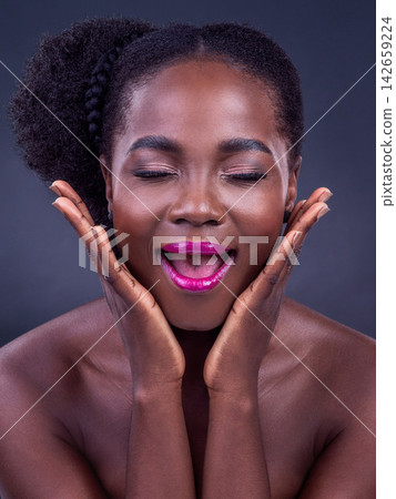Black woman, makeup and surprise expression in studio with bold lipstick for beauty on dark background. Smile, African female person and vibrant face or bright cosmetic or foundation on backdrop Black woman, makeup and surprise expression in studio with bold lipstick for beauty on dark background. Smile, African female person and vibrant face or bright cosmetic or foundation on backdrop 142659224