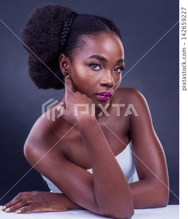 Black woman, skincare and makeup in studio with serious face for confidence and cosmetics. Portrait of model with beauty, dermatology and foundation for cosmetology and hair style on dark background Black woman, skincare and makeup in studio with serious face for confidence and cosmetics. Portrait of model with beauty, dermatology and foundation for cosmetology and hair style on dark background 142659227