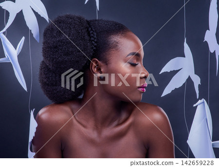 Black model, paper bird and beauty for freedom, peace and wellness isolated in dark background. African woman, cosmetics and abstract fantasy with makeup, skincare and creative animal art or origami 142659228