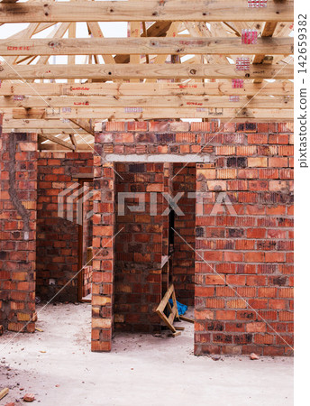 Property, brick wall and new real estate project for construction, development and dream home frame. House, building and architecture with structure, worksite and suburban improvement and design Property, brick wall and new real estate project for construction, development and dream home frame. House, building and architecture with structure, worksite and suburban improvement and design 142659382