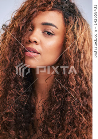 Portrait, woman and curls, hair and studio, healthy or haircare with beauty for natural texture, growth and change. Confident, person and cosmetics, shine or results for glow in white background Portrait, woman and curls, hair and studio, healthy or haircare with beauty for natural texture, growth and change. Confident, person and cosmetics, shine or results for glow in white background 142659433
