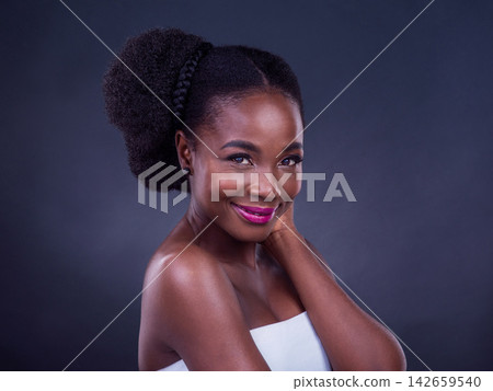 African woman, beauty and makeup in studio with happy face for confidence and cosmetics on a gray background. Portrait of young model with skincare, dermatology and foundation for cosmetology results African woman, beauty and makeup in studio with happy face for confidence and cosmetics on a gray background. Portrait of young model with skincare, dermatology and foundation for cosmetology results 142659540