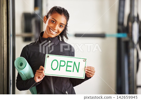 Woman, portrait and open sign in gym for fitness with training, health workout and marketing. Female personal trainer, signage and welcome in wellness club for startup advertising, exercise and sport Woman, portrait and open sign in gym for fitness with training, health workout and marketing. Female personal trainer, signage and welcome in wellness club for startup advertising, exercise and sport 142659945