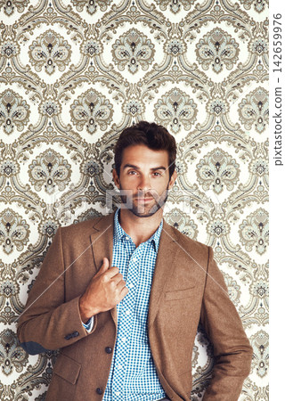 Man, portrait and fashion suit in studio, designer outfit and style on wallpaper background. Male person, professional and creative business for trend or aesthetic, confident and gentleman in blazer 142659976