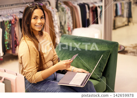 Happy woman and laptop with credit card for online shopping, ecommerce and virtual transaction. Female person, computer and web payment on sofa for sale in designer boutique and luxury subscription Happy woman and laptop with credit card for online shopping, ecommerce and virtual transaction. Female person, computer and web payment on sofa for sale in designer boutique and luxury subscription 142659978