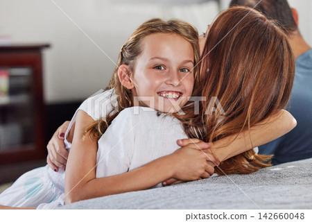 Portrait, mother and hug happy kid in home for love, care and family bonding together in living room. Face, smile and girl embrace mom for support, connection and relationship of child with parents Portrait, mother and hug happy kid in home for love, care and family bonding together in living room. Face, smile and girl embrace mom for support, connection and relationship of child with parents 142660048