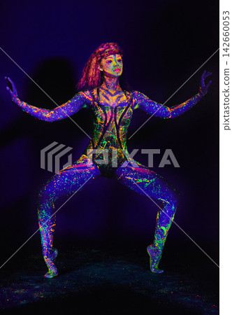Body, paint and dance of woman in neon art, unique culture and fantasy aesthetic in studio. Creative, design and girl in color makeup for stage, identity or character inspiration on dark background Body, paint and dance of woman in neon art, unique culture and fantasy aesthetic in studio. Creative, design and girl in color makeup for stage, identity or character inspiration on dark background 142660053