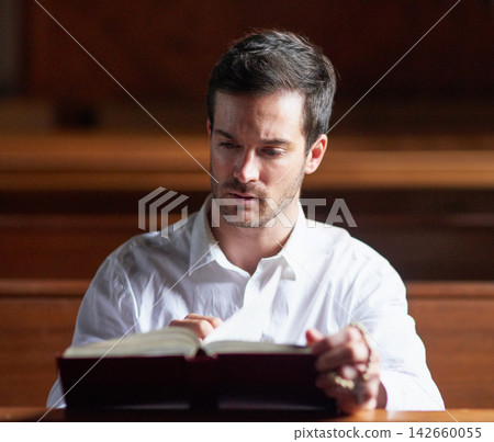 Reading bible, man and thinking in church for prayer, faith or learning for spirituality. Christian male person, gospel or worship with holy book for healing, praise or religion for culture in chapel Reading bible, man and thinking in church for prayer, faith or learning for spirituality. Christian male person, gospel or worship with holy book for healing, praise or religion for culture in chapel 142660055