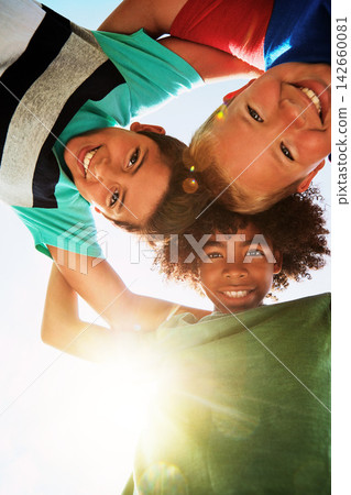 Happy, low angle and portrait of boys on camp for friendship, playing and fun together. Diversity, youth and children huddle in circle for childhood, game and hug for school, recess and playground Happy, low angle and portrait of boys on camp for friendship, playing and fun together. Diversity, youth and children huddle in circle for childhood, game and hug for school, recess and playground 142660081