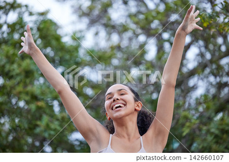 Girl, smile and confident in nature for freedom, trees and wellness in park for weekend trip. Female person, celebration and proud of peace or calm in garden, vacation and relax by plants in outdoor 142660107