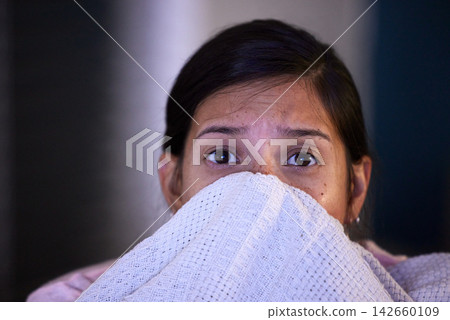 Woman, watching tv and scared with blanket, night and hiding on sofa for horror, movies and show in living room. Girl, dark and television in lounge with streaming, subscription and fear of film Woman, watching tv and scared with blanket, night and hiding on sofa for horror, movies and show in living room. Girl, dark and television in lounge with streaming, subscription and fear of film 142660109